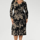 The V-neckline and gentle gathers at the front and back enhance the shape through the torso, while shelf lining through the bust ensures comfort and coverage. 