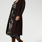 The Nadine Dress is a sophisticated wardrobe essential, designed and made in Australia from our signature black dry-touch stretch jersey. Featuring a deep, inky floral print in a rich coffee hue, this dress offers a modern take on timeless elegance. The soft A-line silhouette flatters the figure, while ruched sleeves add a contemporary edge.