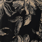 Swatch Image of the Night Lily Print on a black dry touch jersey base with coffee coloured floral print. Used to craft a collection of women's dresses, tops and dresses. Made in Australia in sizes 8-24.