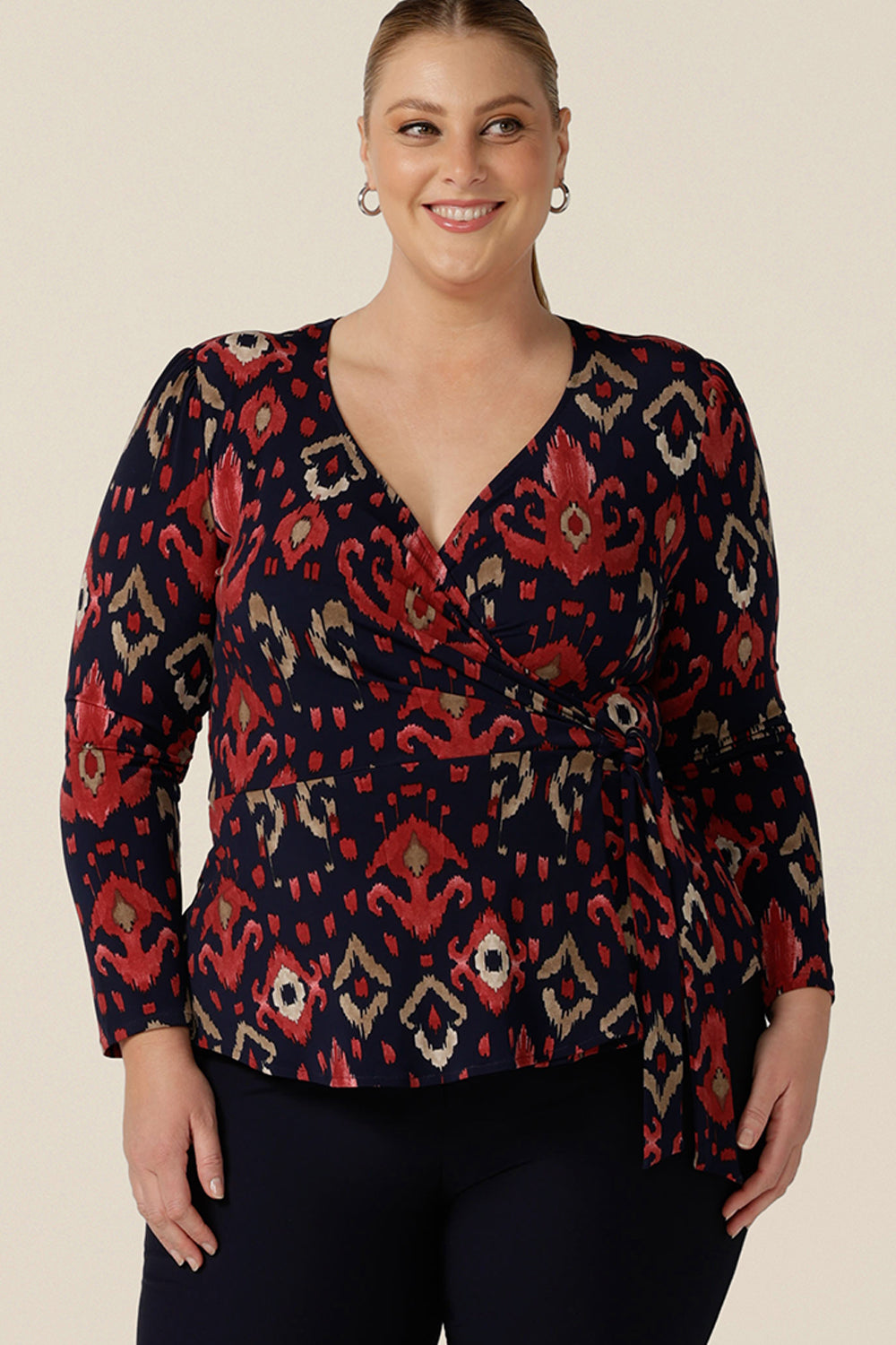 A great top for fuller figure and curvy women, this long sleeve wrap top in Ikat print is comfortable and easy to wear and care for. An elegant workwear top, the Noah Top is made in Australia by Australian and New Zealand women's clothing label, Leina and Fleur.
