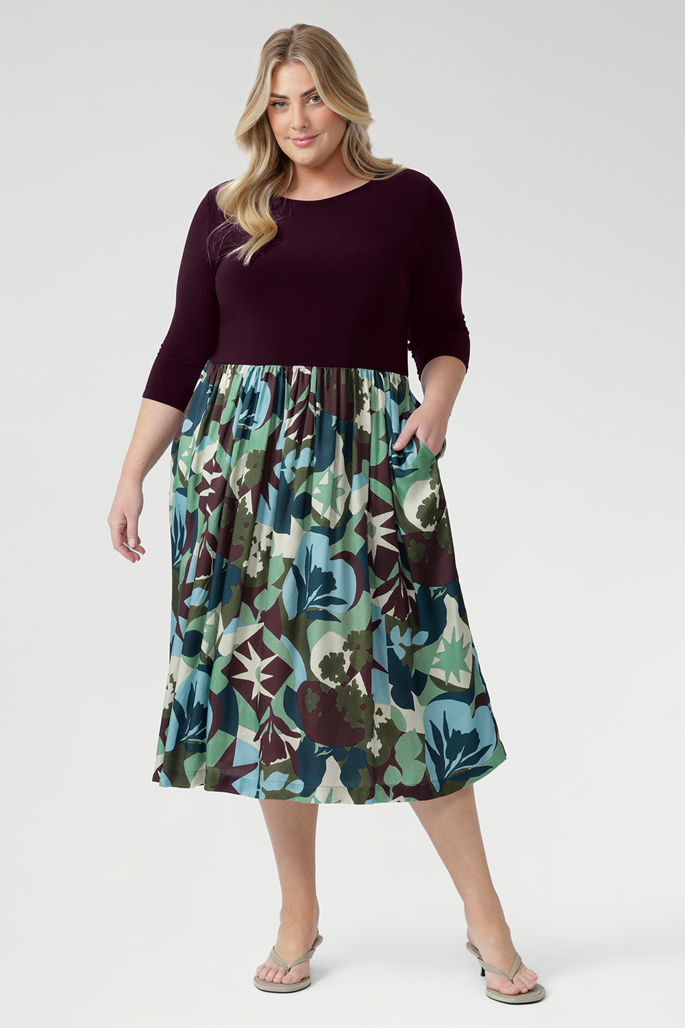 The flattering fit-and-flare silhouette is designed to suit all body shapes, with the option to wear it with or without its matching belt for versatile styling. Plus size model wear 3/4 sleeved dress with matching kitten heels.