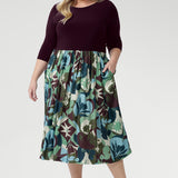 The flattering fit-and-flare silhouette is designed to suit all body shapes, with the option to wear it with or without its matching belt for versatile styling. Plus size model wear 3/4 sleeved dress with matching kitten heels.