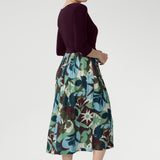 The midi-length A-line skirt features a bold abstract print in tones of green, blue, and plum—eye-catching yet timeless. With practical side pockets and a breezy, unlined skirt, the Joanie Dress is made for busy days, relaxed weekends, and everything in between. Proudly designed and made in Australia, this is a wardrobe essential that works as hard as you do.
