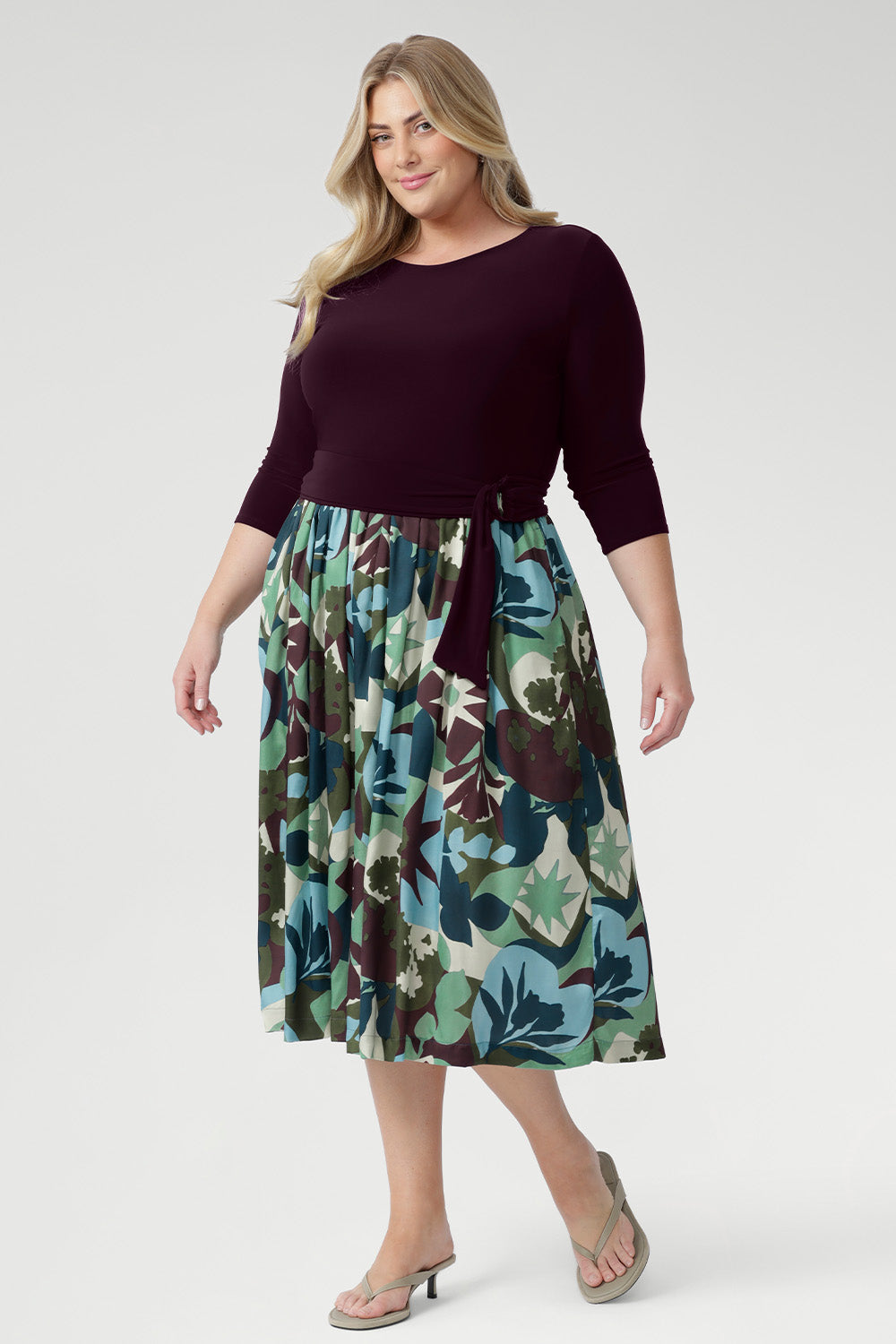 Blending a soft, dry-touch stretch jersey bodice in rich plum with a flowing Italian Viscose skirt, this dress delivers the perfect balance of structure and movement. The flattering fit-and-flare silhouette is designed to suit all body shapes, with the option to wear it with or without its matching belt for versatile styling.
