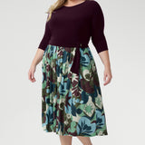 Blending a soft, dry-touch stretch jersey bodice in rich plum with a flowing Italian Viscose skirt, this dress delivers the perfect balance of structure and movement. The flattering fit-and-flare silhouette is designed to suit all body shapes, with the option to wear it with or without its matching belt for versatile styling.