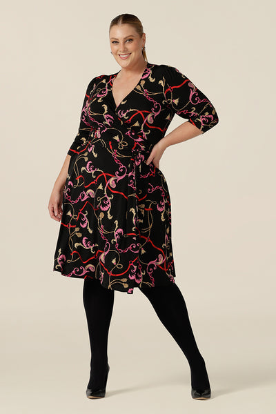 A knee length wrap dress in rococo print jersey looks sassy for work and occasionwear. Shown for plus sizes, this 3/4 sleeve wrap dress is made in Australia in dress sizes 8 to 24.