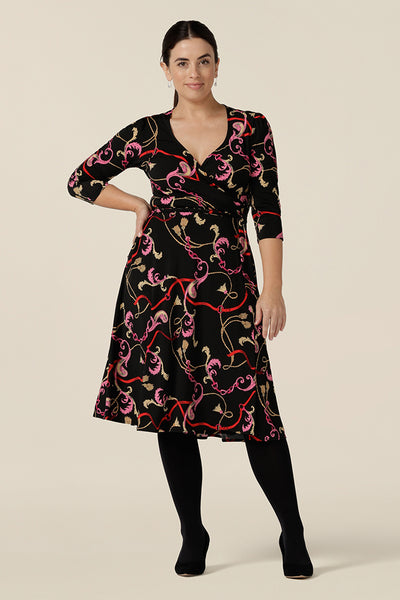 A knee length wrap dress in rococo print jersey looks sassy for work and occasionwear. Shown in a size 10, this 3/4 sleeve wrap dress is made in Australia in dress sizes 8 to 24.