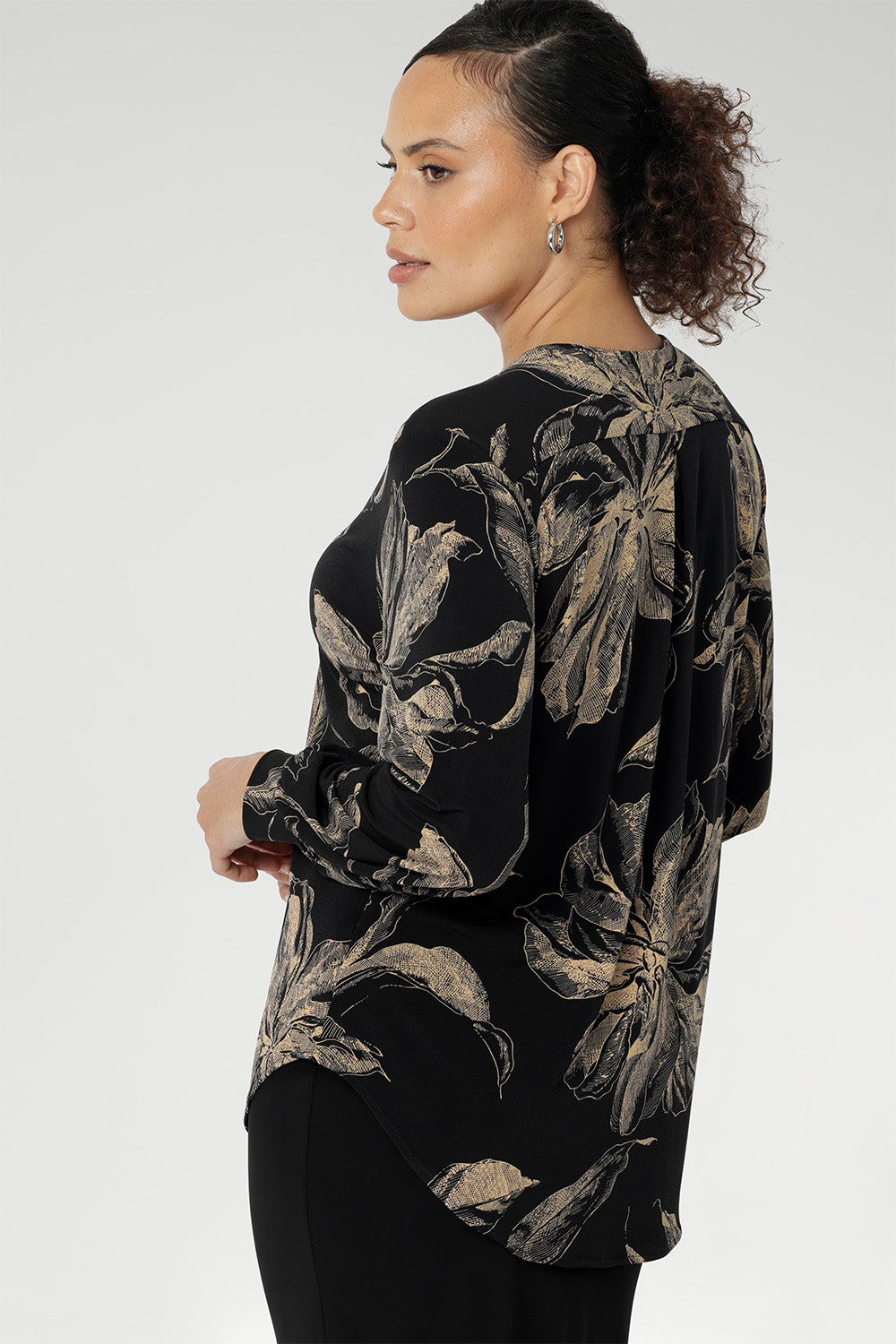 Elevate your wardrobe with the Paeton Top, a timeless piece from our luxe separates collection, available in inclusive sizes 8–24. Proudly designed and made in Australia, this top is crafted from premium black dry-touch stretch jersey for all-day comfort and a flattering, relaxed silhouette that drapes effortlessly on the body. 