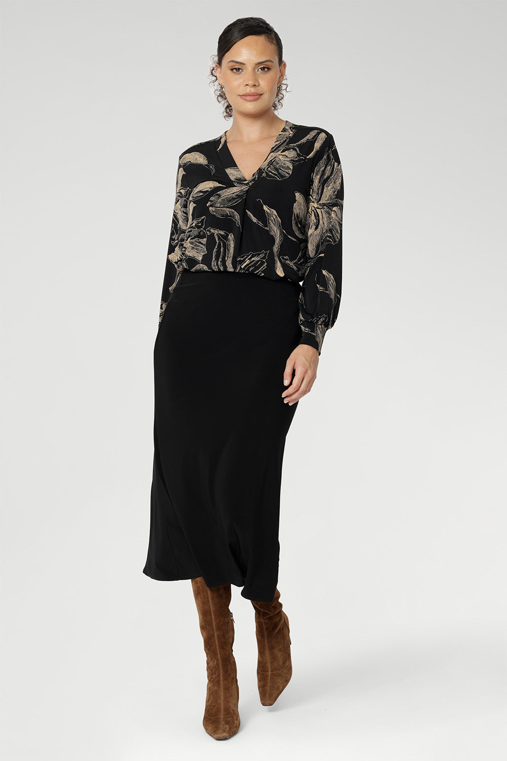 Made in Australia from premium black dry-touch jersey, this top combines soft stretch with a flattering, relaxed fit that drapes gracefully on the body. Size 10 model wears her Paeton Top tucked into her black Asher Skirt.