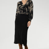 Made in Australia from premium black dry-touch jersey, this top combines soft stretch with a flattering, relaxed fit that drapes gracefully on the body. Size 10 model wears her Paeton Top tucked into her black Asher Skirt.