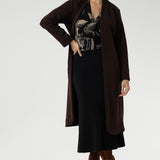The rich coffee-hued floral print adds a bold, inky elegance that captures the essence of the season. Paeton features a polished style to your everyday wardrobe. Size 10 model wears brown trenchcoat for a warm winter look.