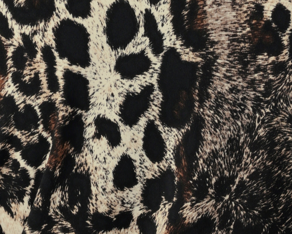 Panthera print is on a dry-touch jersey base with print details in black, cream and brown shades. The Fabric has soft stretch. Used by women's clothing brand Leina & Fleur to create a collection of tops, pants and skirts for Australian women in sizes 8-24.