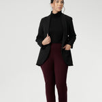Petite Height woman wears Size 10 pull-on style pant, crafted from stretchy, dry touch Ponte fabric that provides firm stretch and full body comfort. Available in sizes 8-24. Workwear pants are available in 3 lengths.