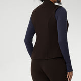 The fitted vest features a flattering V-neckline, sleeveless design, and a two-way opening zip for added flexibility. It also includes back side panels for a tailored fit and is available in sizes 8-24. 