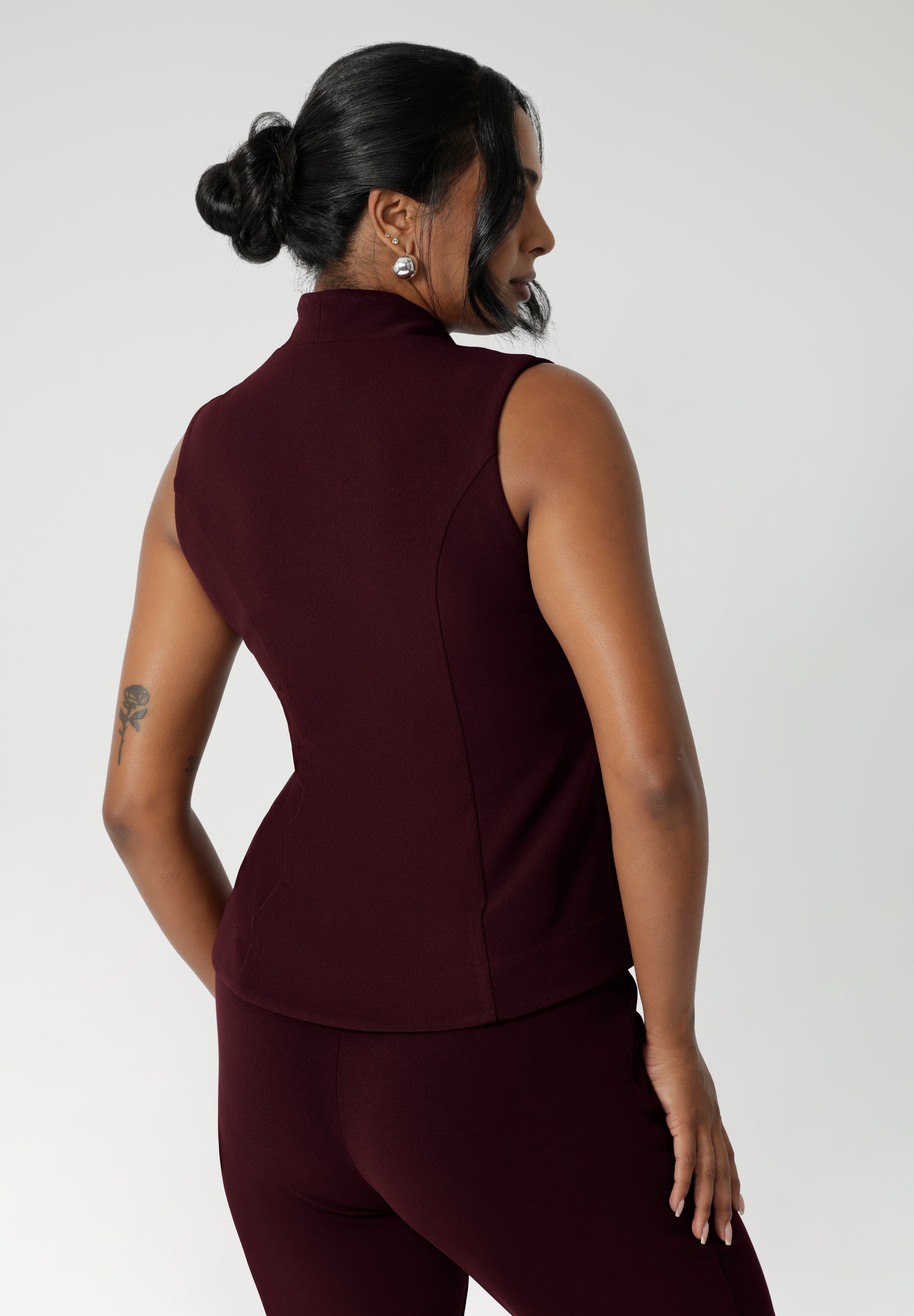 The back side panels provide a tailored, contoured fit that enhances the overall silhouette. Available in sizes 8-24, this piece is proudly made in Australia by Leina & Fleur, combining both high-quality craftsmanship and contemporary style.