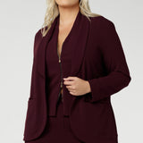 Women's wine coloured suiting vest features a flattering V-neck and is sleeveless for a modern, sleek look. It’s double ended, two-way zip, offers versatility, ease of movement and endless styling options. Available in sizes 8-24.