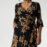 Portia features our signature fluted 3/4 sleeves for a romantic touch, along with a gathered detail at the sleeve head for added charm. Women's Wrap dress has floral design print on a black base. Available in size 8-24. 