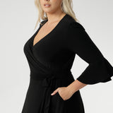 Crafted with a fully functional wrap front and adjustable waist ties, Portia allows you to achieve the perfect fit with ease. The double-layer back bodice adds extra coverage and a smooth silhouette, while the 3/4 length sleeves with romantic fluted detailing and soft gathers at the sleeve head create a beautifully feminine finish.