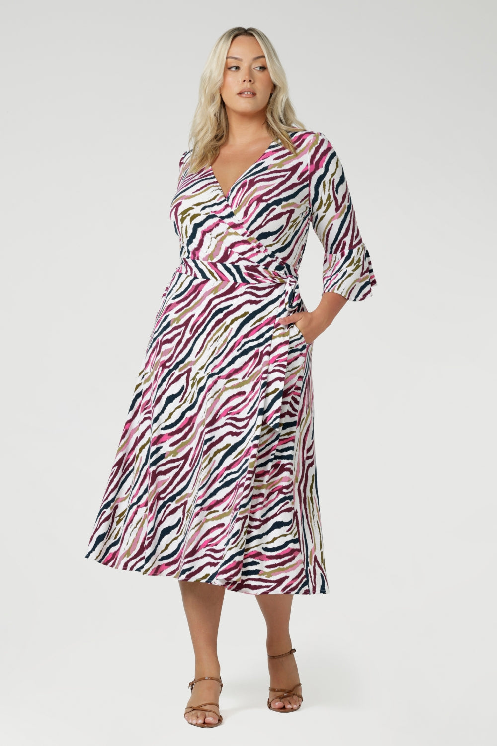 The Portia Wrap Dress is a stylish and functional below-the-knee dress, perfect for any occasion. Made from Australian-made dry-touch jersey, the fabric has a drier hand feel with a soft stretch, ensuring comfort and ease of movement