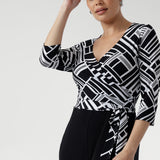 Thoughtfully finished with ¾-length sleeves and a clean neckline, the Puzzle Jumpsuit transitions seamlessly from workwear to evening outings, making it the ultimate wardrobe multitasker.