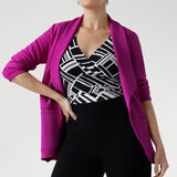 The ultimate wardrobe multitasker is proudly designed and made in Australia, this modern yet timeless silhouette is ideal for women seeking polished style without compromising on comfort. Model has added a bright pink blazer over the playsuit to pop the colour.