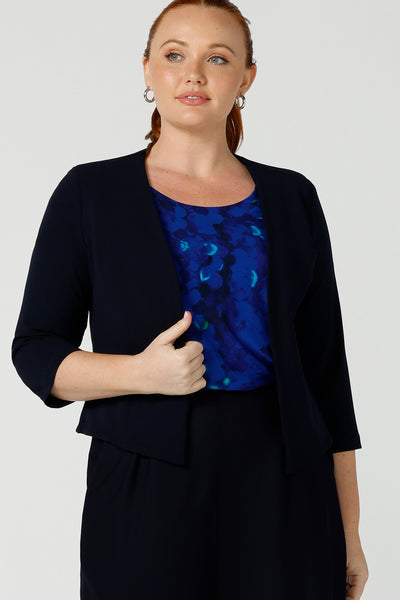 Australian made open-fronted collarless tailored jacket for stylish corporate women. A soft tailoring jacket in stretch scuba crepe jersey, the Rainy Jacket is collarless and open-fronted with cropped sleeves. Womens size inclusive fashion from petite to plus size 8 - 24.