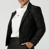 A size 12 woman wearing the Raleigh Jacket in Leopard print. Printed Ponti tailored jacket that is easy care and has a matching pant. Comfortable and stylish workwear for women. Made in Australia for women size 8 - 24.