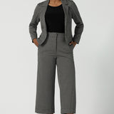 A size 10 Raleigh Jacket in Jacqaurd has a houndstooth print check with a tailored construction. Comfortable and corporate work wear for women. Petite to plus size clothing for workwear for women size 8-24.