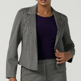 A size 10 Raleigh Jacket in Jacqaurd has a houndstooth print check with a tailored construction. Comfortable and corporate work wear for women. Petite to plus size clothing for workwear for women size 8-24. 