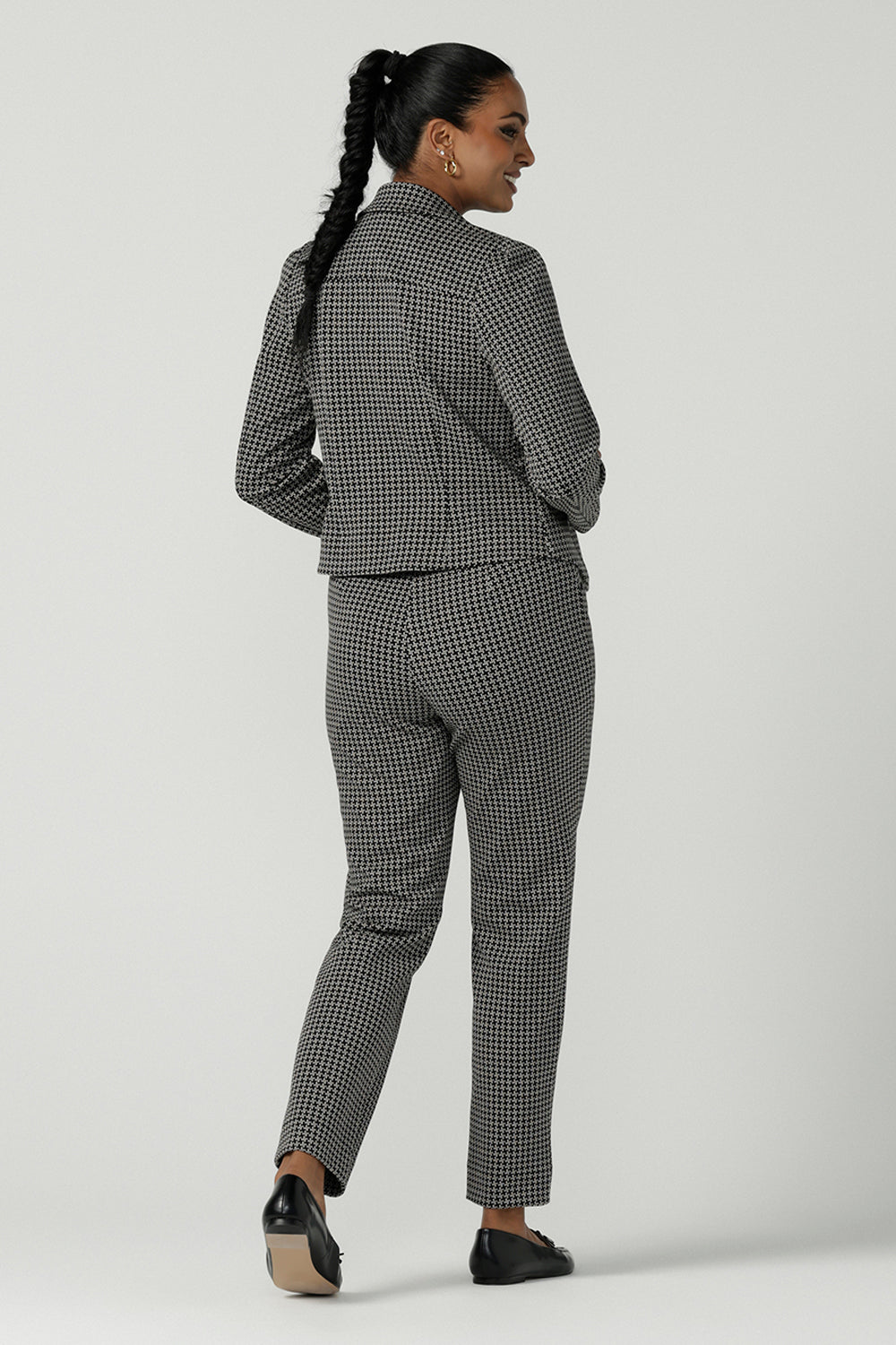 Frontview of a A size 10 woman wears the Lulu Tailored pant in Jacquard. A slim fit tailored pant in comfortable ponte for petite to plus size. Made in Australia for women size 8-24 Styled back with a matching Raleigh Jacket in Jacquard and styled back with a black leather ballet flat. 