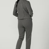 Frontview of a A size 10 woman wears the Lulu Tailored pant in Jacquard. A slim fit tailored pant in comfortable ponte for petite to plus size. Made in Australia for women size 8-24 Styled back with a matching Raleigh Jacket in Jacquard and styled back with a black leather ballet flat. 