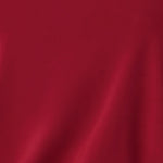 Fabric swatch of red slinky jersey fabric used by Australian and New Zealand women's clothing brand Leina & Fleur to make a collection of women’s travel and event wear dresses and tops.