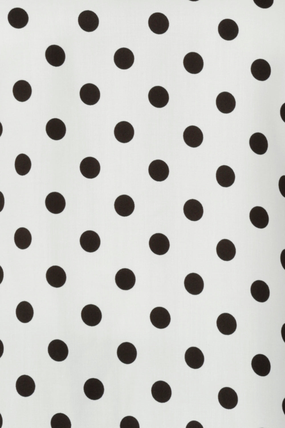 Fabric swatch of Rollo Spot print is on a white tencel viscose base with spot details in black. This fabric is no stretch, but a soft lightweight feel. Blending style with conscious design this print is used by Australian clothing brand Leina & Fleur tops for woman in sizes 8-24.