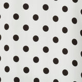 Fabric swatch of Rollo Spot print is on a white tencel viscose base with spot details in black. This fabric is no stretch, but a soft lightweight feel. Blending style with conscious design this print is used by Australian clothing brand Leina & Fleur tops for woman in sizes 8-24.