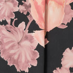 The Romantic Floral print blooms across a black satin base, with delicate pink tones adding depth and softness to the look. Crafted by Leina & Fleur to create a collection of women's tailored blouses. Romantic Floral is a beautifully feminine and elevated wardrobe essential, perfect for both work and occasion dressing. 