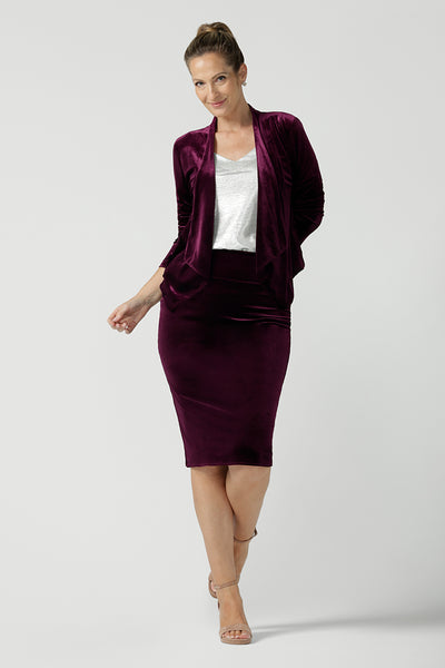 Back view of a Brooke velour skirt in Wine Velour. A fitted tube skirt in velour knee length. Styled back with Chrissy top in Bullion xanadu. Made in Australia for plus to petite women size 8 - 24. Styled back with a wine velour Romy jacket with waterfall collar. 