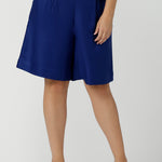Close up of a size 12 women wearing the Houston Blazer in Cobalt linen size 12. Styled back with a matching Cobalt Linen Blazer with a button front and patch pockets. Made in Australia for women size 8 to 24.