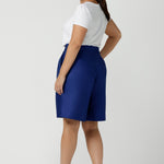 Back view of women wearing the Houston Blazer in Cobalt linen size 12. Styled back with a matching Cobalt Linen Blazer with a button front and patch pockets. Made in Australia for women size 8 to 24.