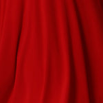 Fabric swatch of Red fabric on dry touch jersey fabric used by Australian and New Zealand women's clothing brand Leina & Fleur to make a collection of women’s travel and event wear dresses and tops.