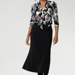 A sophisticated wardrobe essential, the Sage Top in Moss Boss offers timeless style with modern versatility. Designed for effortless wear from desk to dinner, this women’s top features a soft tie neckline that can be styled loose and relaxed, draped low for a casual-chic vibe, or fastened high for a more polished, elevated look. 