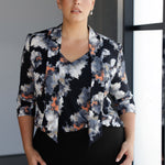 Designed for effortless wear from desk to dinner, this women’s top features a soft tie neckline that can be styled loose and relaxed, draped low for a casual-chic vibe, or fastened high for a more polished, elevated look. The ¾-length sleeves fit comfortably under jackets and blazers, making it a perfect layering piece for year-round wear.