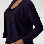 This stylish cardigan features a deep V-neckline that creates a flattering and elegant silhouette. It includes two covered button fastenings for a refined, minimalist look, while the long sleeves provide coverage and warmth when needed.