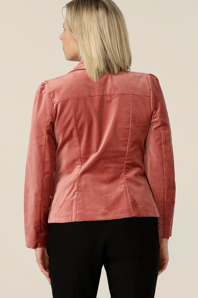 Back view of a size 10 woman wearing a Velveteen suit jacket in Musk pink. Featuring a tailored, single button fastening, women's jacket and tailored, flared leg pants, this occasionwear jacket is made in Australia by Australian and New Zealand women's clothing label, L&F.