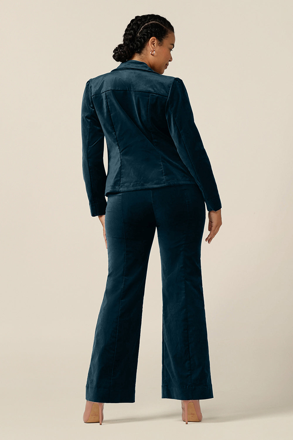 Back view of a size 12 woman wearing a Velveteen suit in petrol green. Featuring a tailored, single button fastening, women's jacket and tailored, flared leg pants, this occasionwear suit is made in Australia by Australian and New Zealand women's clothing label, L&F. 