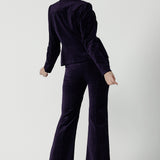 Back view of a Jonas pant in Purple Velveteen is a kick flare pant made in purple velveteen fabric. Cocktail pant suit sets. Made in Australia for women size 8 - 24.