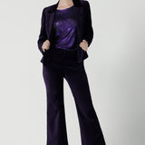 Close up of a Jonas pant in Purple Velveteen is a kick flare pant made in purple velveteen fabric. Cocktail pant suit sets. Made in Australia for women size 8 - 24.