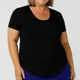 A good plus size top, this round neck, short sleeve top in black bamboo jersey is comfortable for work and casual wear. Made in Australia by ladies clothing brand, Leina & Fleur, shop black tops for women online in sizes 8 to 24 in L&F's online fashion boutique.