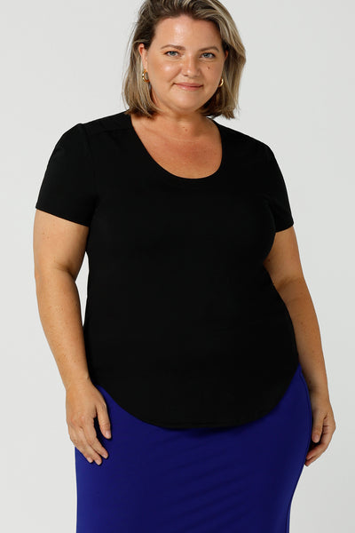 A good plus size top, this round neck, short sleeve top in black bamboo jersey is comfortable for work and casual wear. Made in Australia by ladies clothing brand, Leina & Fleur, shop black tops for women online in sizes 8 to 24 in L&F's online fashion boutique.