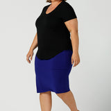 A good plus size top, this round neck, short sleeve top in black bamboo jersey is comfortable for work and casual wear. Worn with a cobalt blue tube skirt, both top and skirt are made in Australia by ladies clothing brand, Leina & Fleur, shop black tops for women online in sizes 8 to 24 in L&F's online fashion boutique.