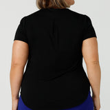 Back view of the shoulder yoke and back pleat of a black bamboo jersey top by Australian and New Zealand fashion brand, Leina & Fleur. A good plus size top, this round neck, short sleeve top in black bamboo jersey is comfortable for work and casual wear. Made in Australia by ladies clothing brand, Leina & Fleur, shop black tops for women online in sizes 8 to 24 in L&F's online fashion boutique.